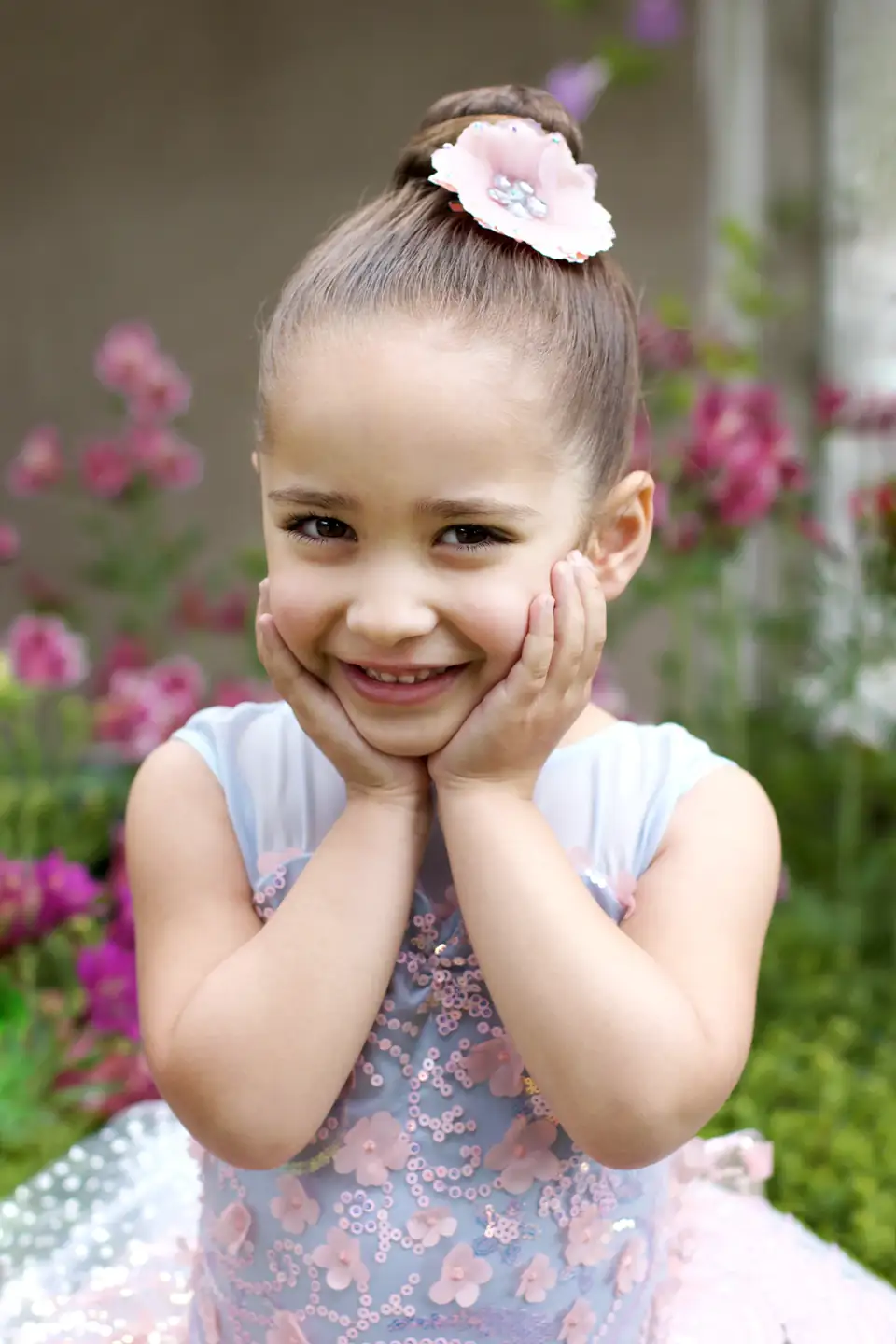 A young Serendipity dancer smiling in costume