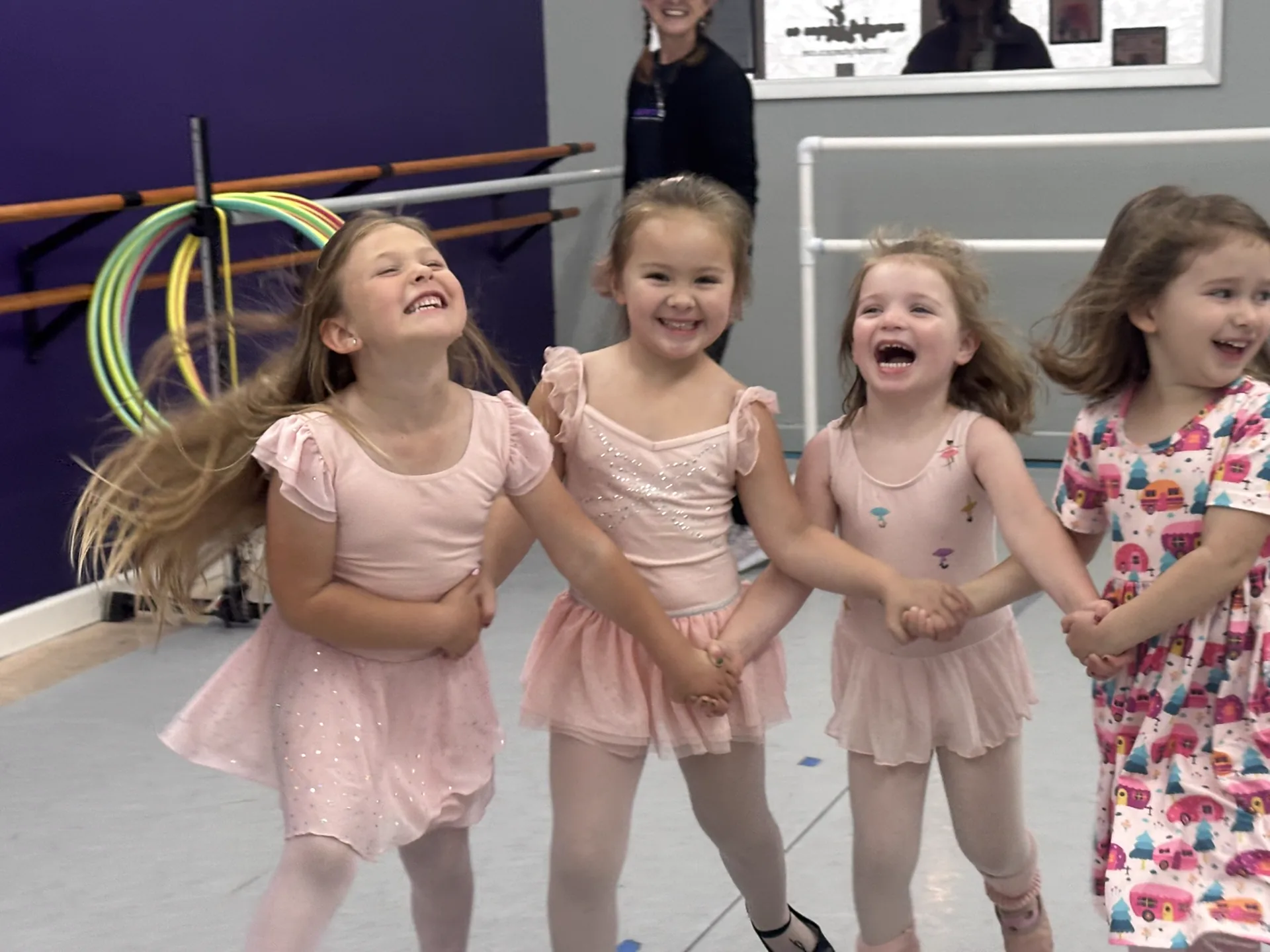 Young Serendipity dancers laughing together during class